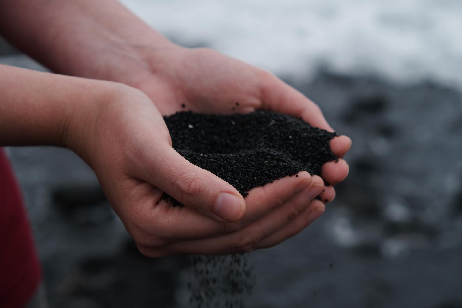 Hands holding home made compost.